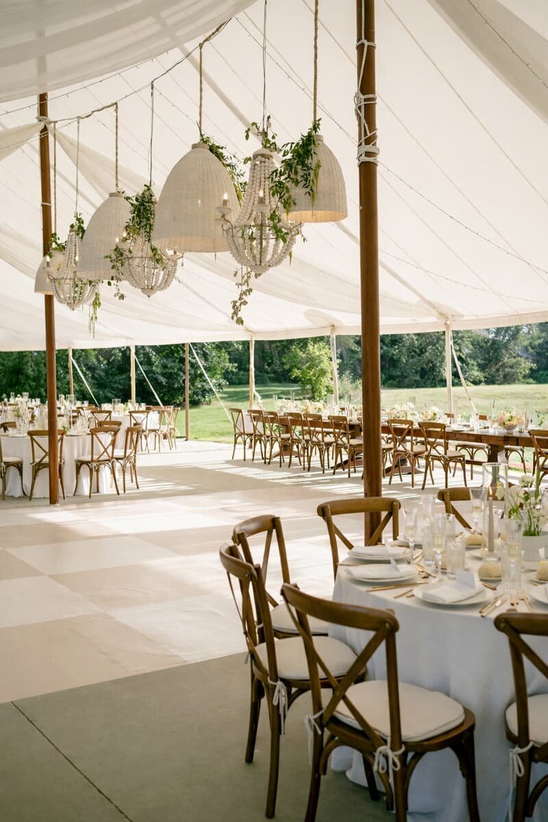 Tented celebration and dance floor at dusk